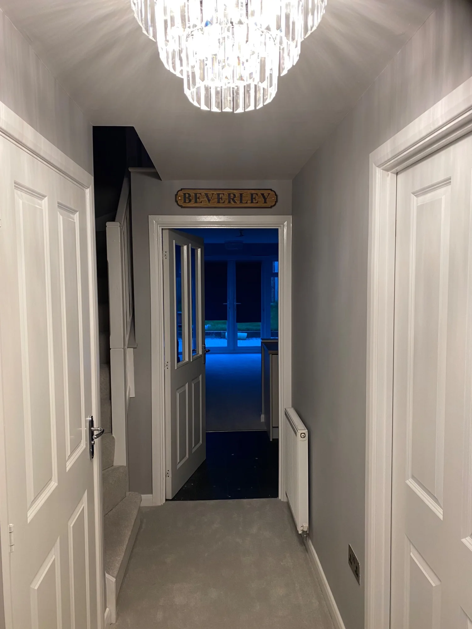 Finished hallway with recessed downlights and feature lighting